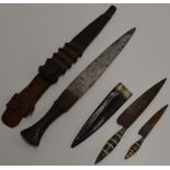 2 OLD EASTERN STYLE DAGGERS WITH LEATHER COVERS