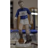 ROYAL COPENHAGEN HAND PAINTED FIGURINE PORCELAIN ORNAMENT MODELLED AS A FOOTBALLER, BY THYMANN,