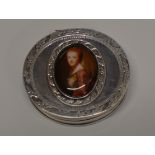 STERLING SILVER SNUFF OR PILL BOX INSET WITH A HAND PAINTED PORTRAIT PANEL OF A LADY, WITH LONDON