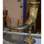 DECORATIVE BRASS MOUNTED ANIMAL HORN MOUNTED ON A GILT STAND