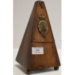 AN OLD WOODEN CASED METRONOME