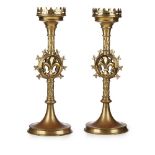 AFTER AUGUSTUS WELBY NORTHMORE PUGIN (1812-1852)PAIR OF GOTHIC REVIVAL BRASS ALTAR CANDLESTICKS,