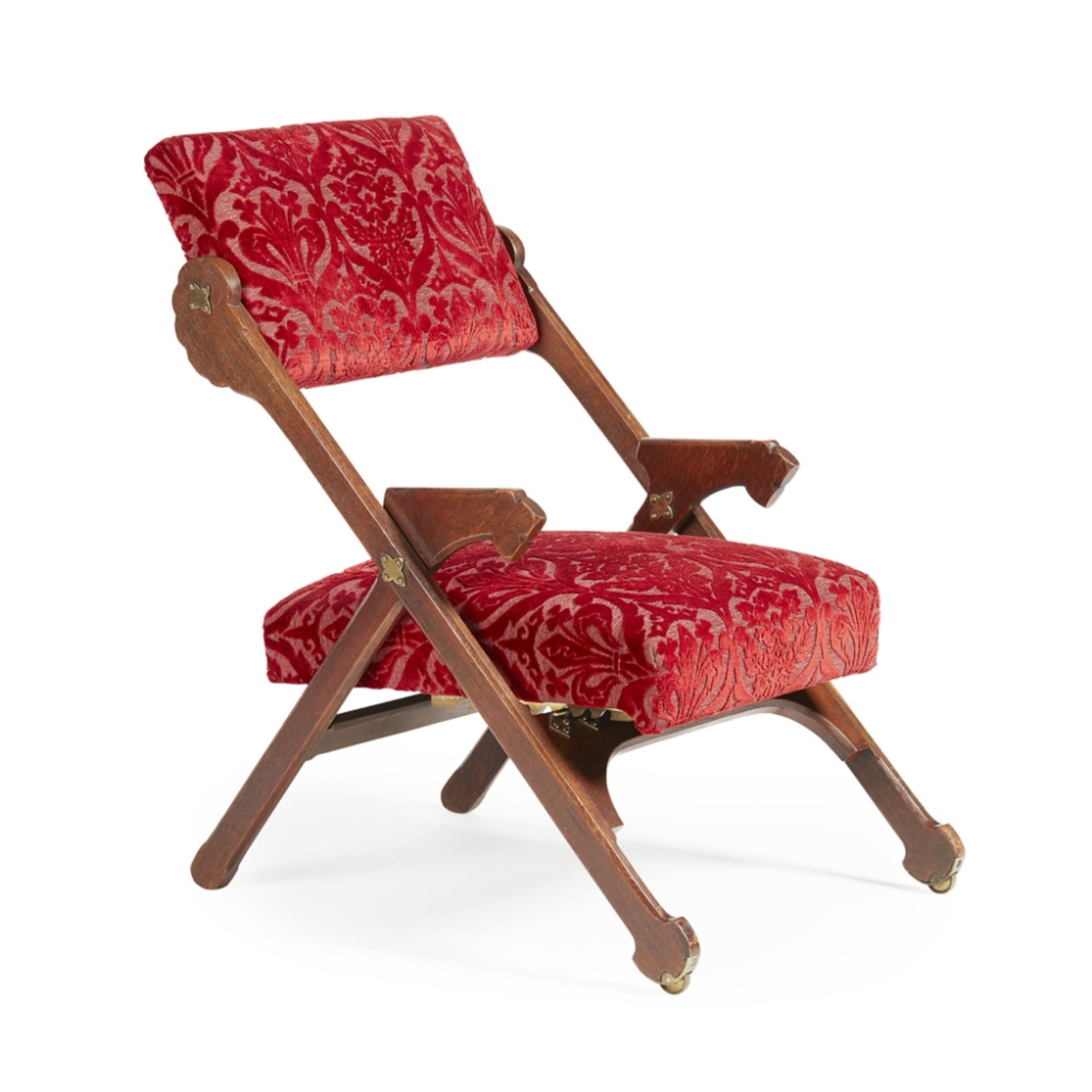 ATTRIBUTED TO CHARLES BEVANGOTHIC REVIVAL OAK ADJUSTABLE FOLDING ARMCHAIR, CIRCA 1870 upholstered in
