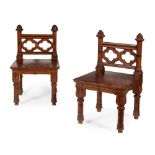 ATTRIBUTED TO JOHN MOYR SMITH (1839-1912)PAIR OF GOTHIC REVIVAL OAK AND EBONISED LOW CHAIRS, CIRCA