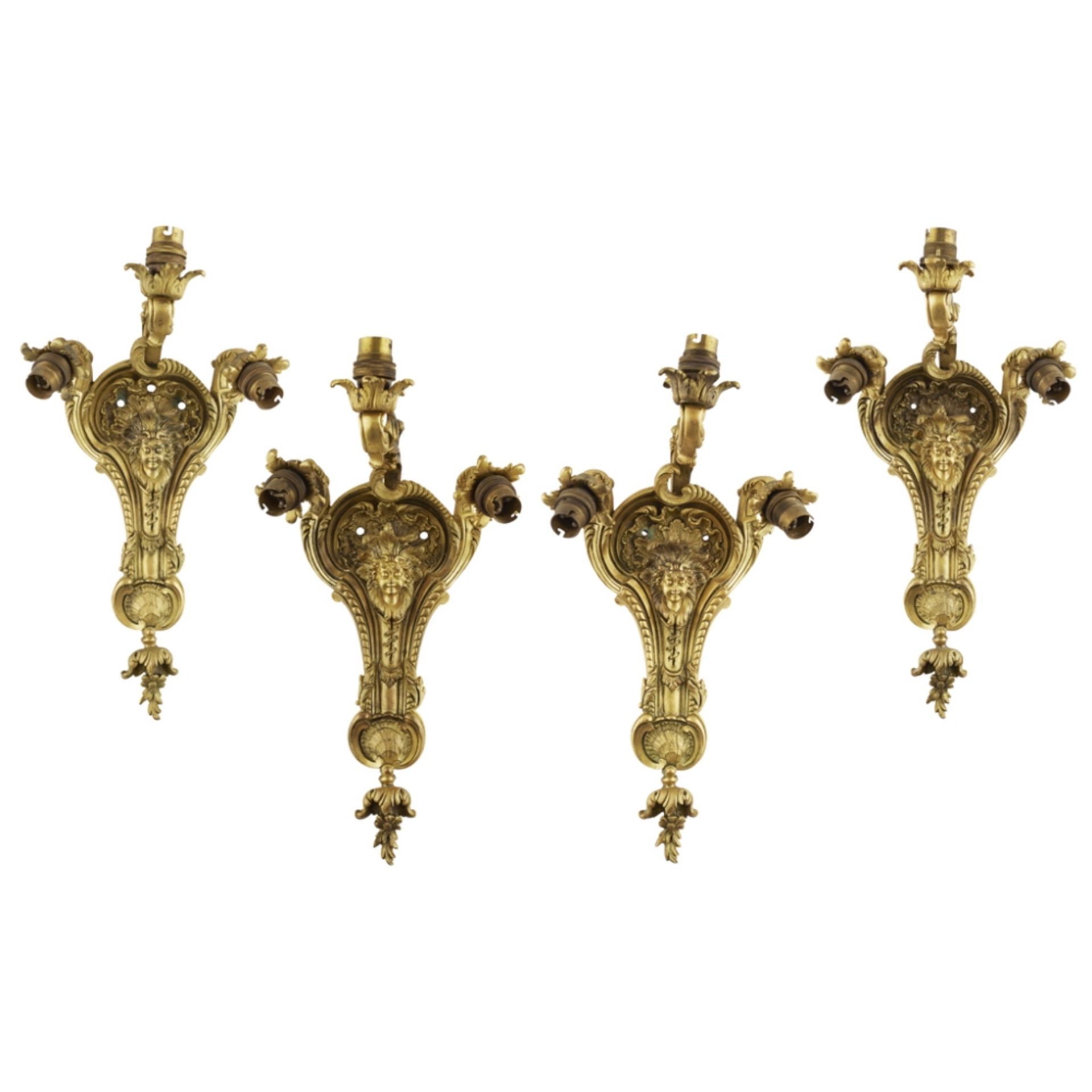 SET OF FOUR FRENCH GILT BRONZE WALL LIGHTSLATE 19TH CENTURY each with one upscrolling and two