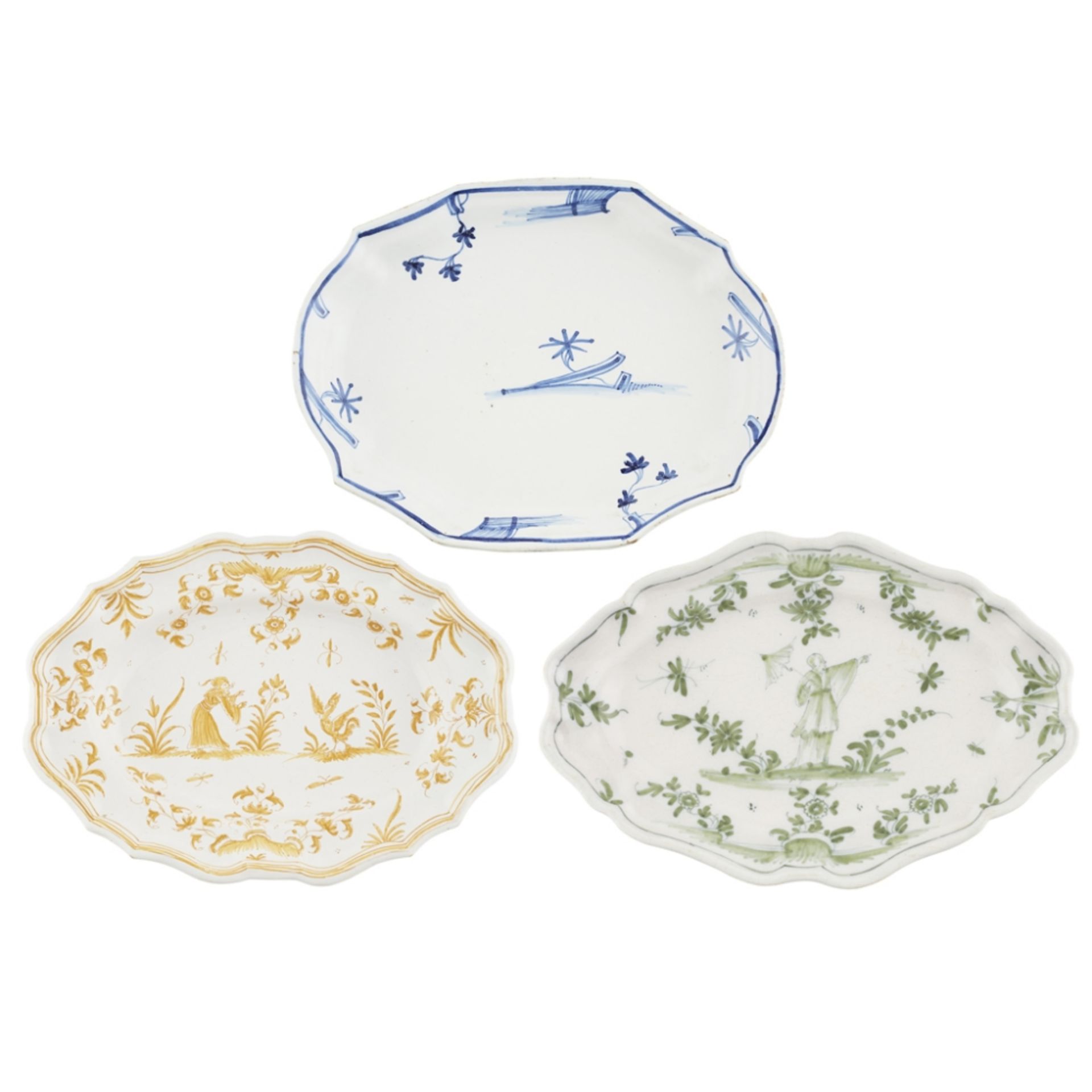 THREE MONOCHROME FRENCH FAIENCE PLATTERS18TH CENTURY of shaped oval form with lobed rims, comprising