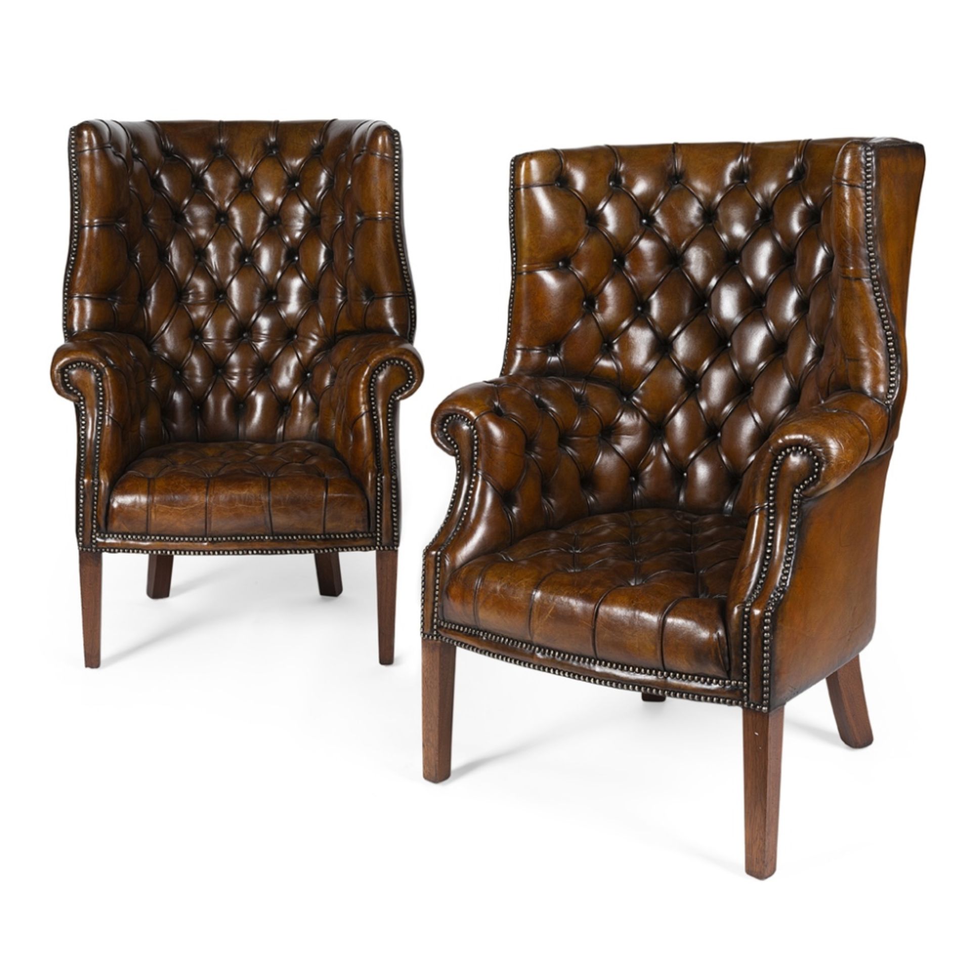 PAIR OF GEORGIAN STYLE BARREL-BACK LEATHER ARMCHAIRS20TH CENTURY the button-upholstered backs and