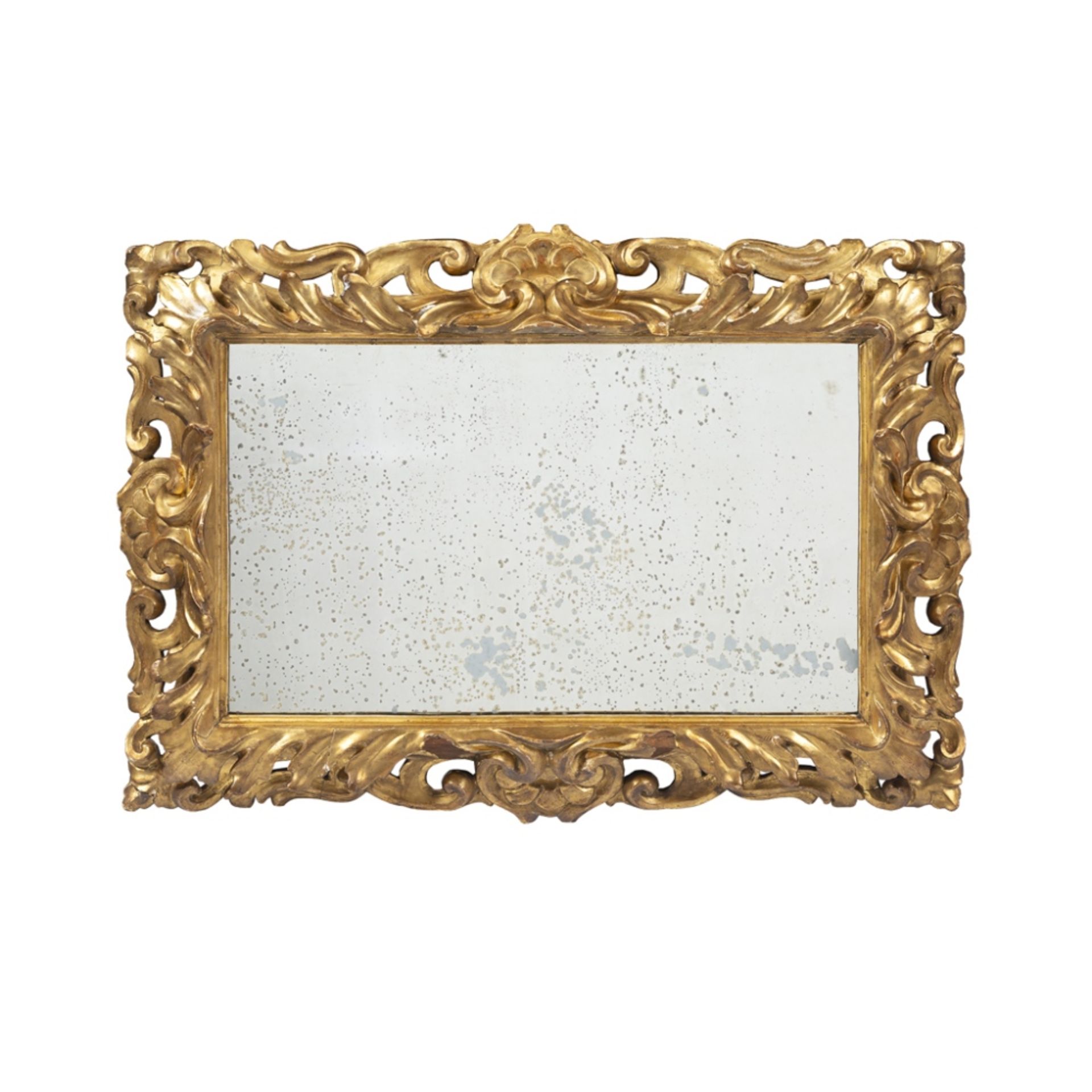 FLORENTINE GILTWOOD MIRROR19TH CENTURY the rectangular mirror plate in a frame pierced and carved