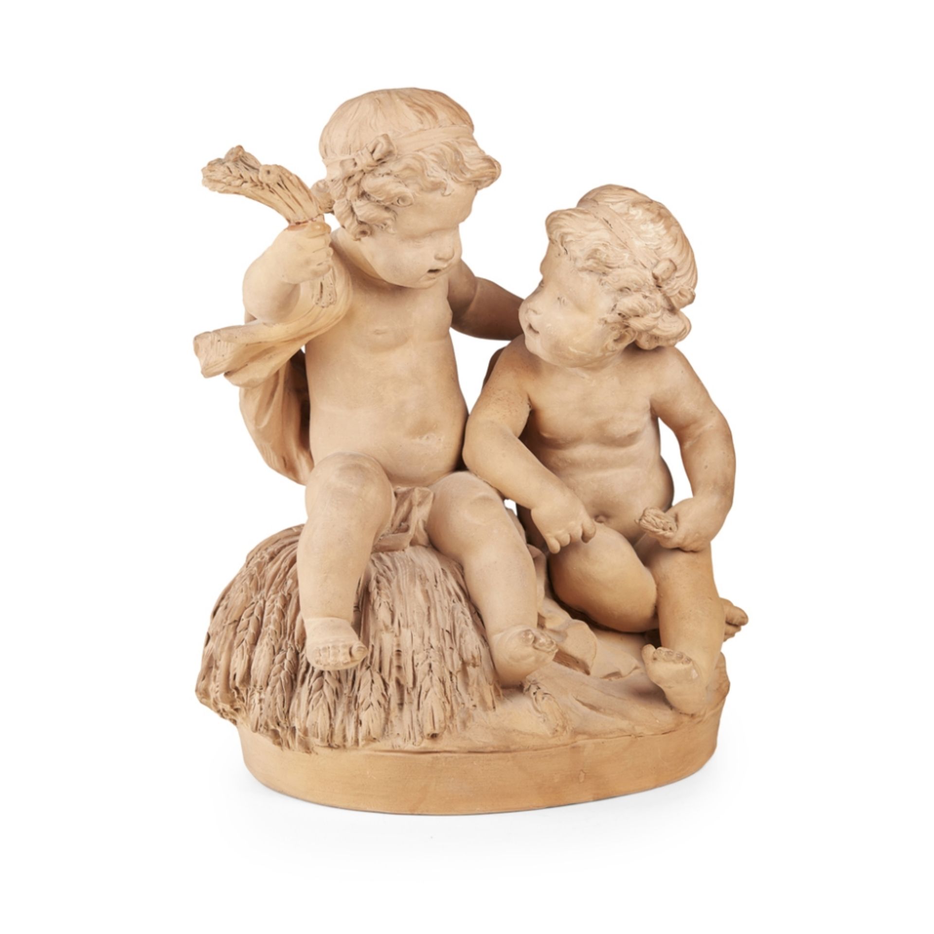 FRENCH TERRACOTTA FIGURE GROUPLATE 19TH CENTURY modelled as two seated putti holding wheat