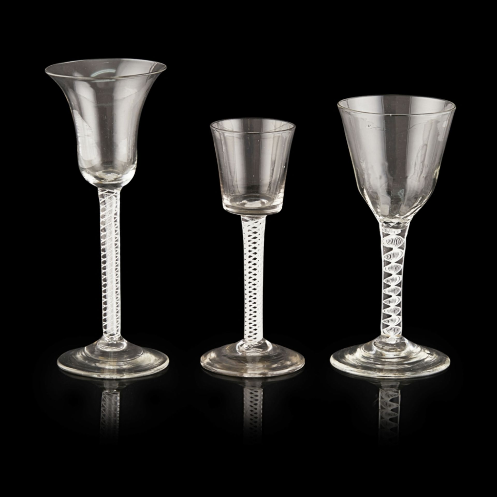 FOUR GEORGIAN TWIST STEM WINE GLASSESMID-18TH CENTURY comprising a bell bowled glass with a mixed - Image 3 of 3