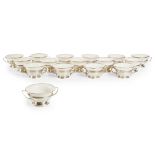SIXTEEN CONSOMMÉ PORCELAIN CUPS AND SILVER STANDSCIRCA 1900 the porcelain marked LENOX, on silver