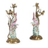 PAIR OF CHINESE EXPORT PORCELAIN PHOENIX18TH CENTURY in famille rose enamels, framed on gilt metal