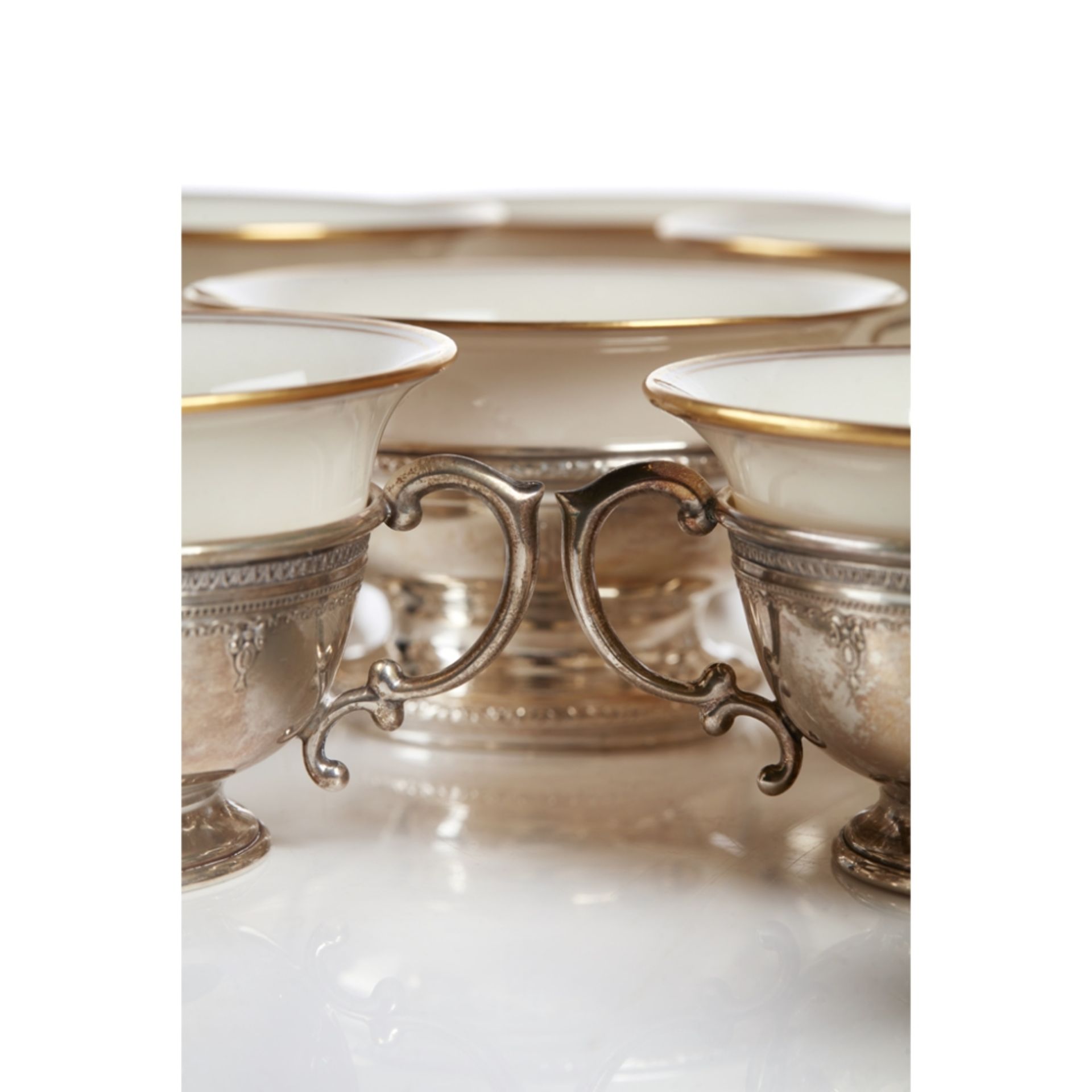 SIXTEEN CONSOMMÉ PORCELAIN CUPS AND SILVER STANDSCIRCA 1900 the porcelain marked LENOX, on silver - Image 4 of 6