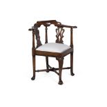 GEORGE II WALNUT CORNER ARMCHAIRMID-18TH CENTURY the curved toprail carved with acanthus leading