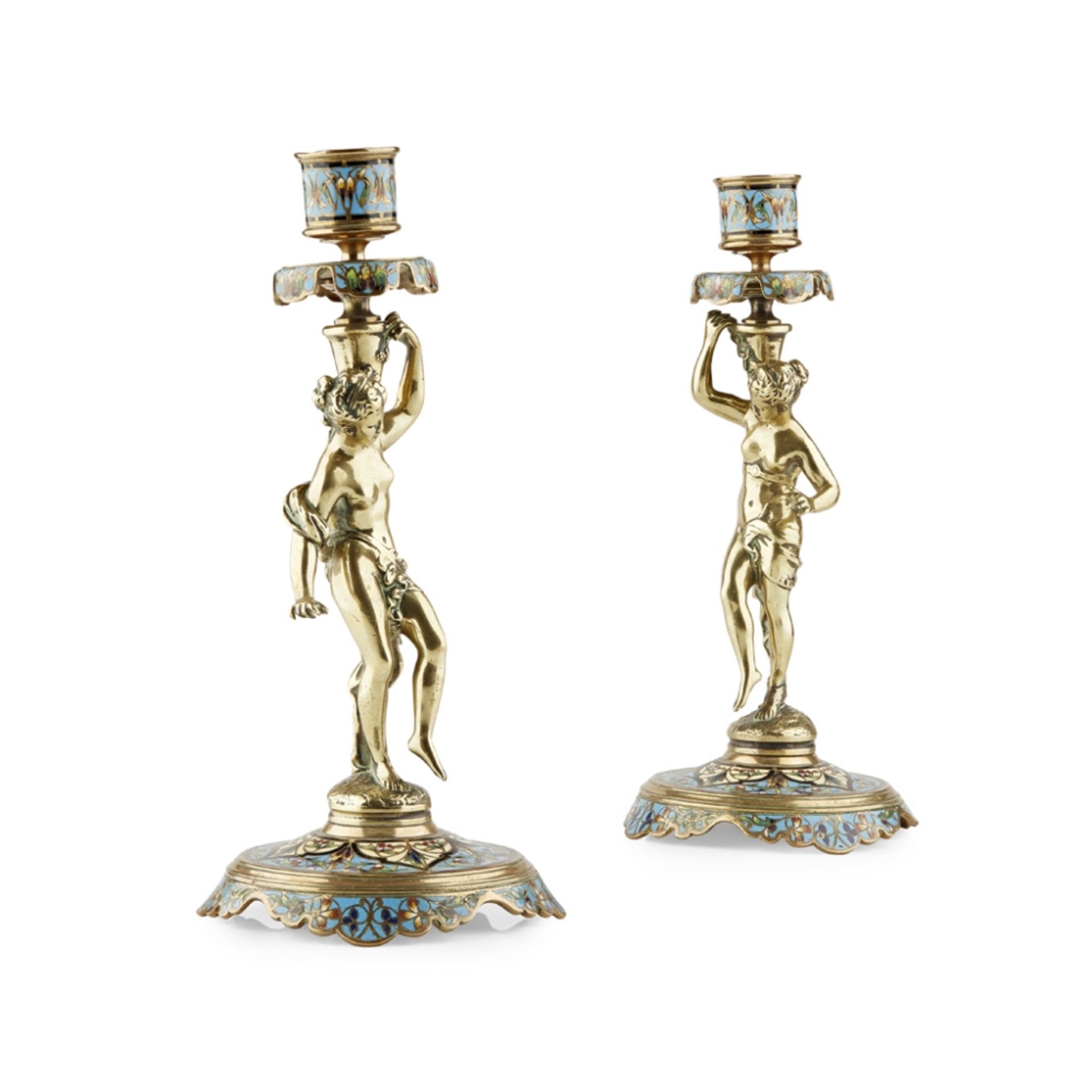 PAIR OF FRENCH CHAMPLEVÉ CANDLESTICKSMID-LATE 19TH CENTURY with cylindrical nozzles supported by