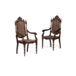 PAIR OF CONTINENTAL ROSEWOOD ARMCHAIRS19TH CENTURY the backs with carved foliate crestings above