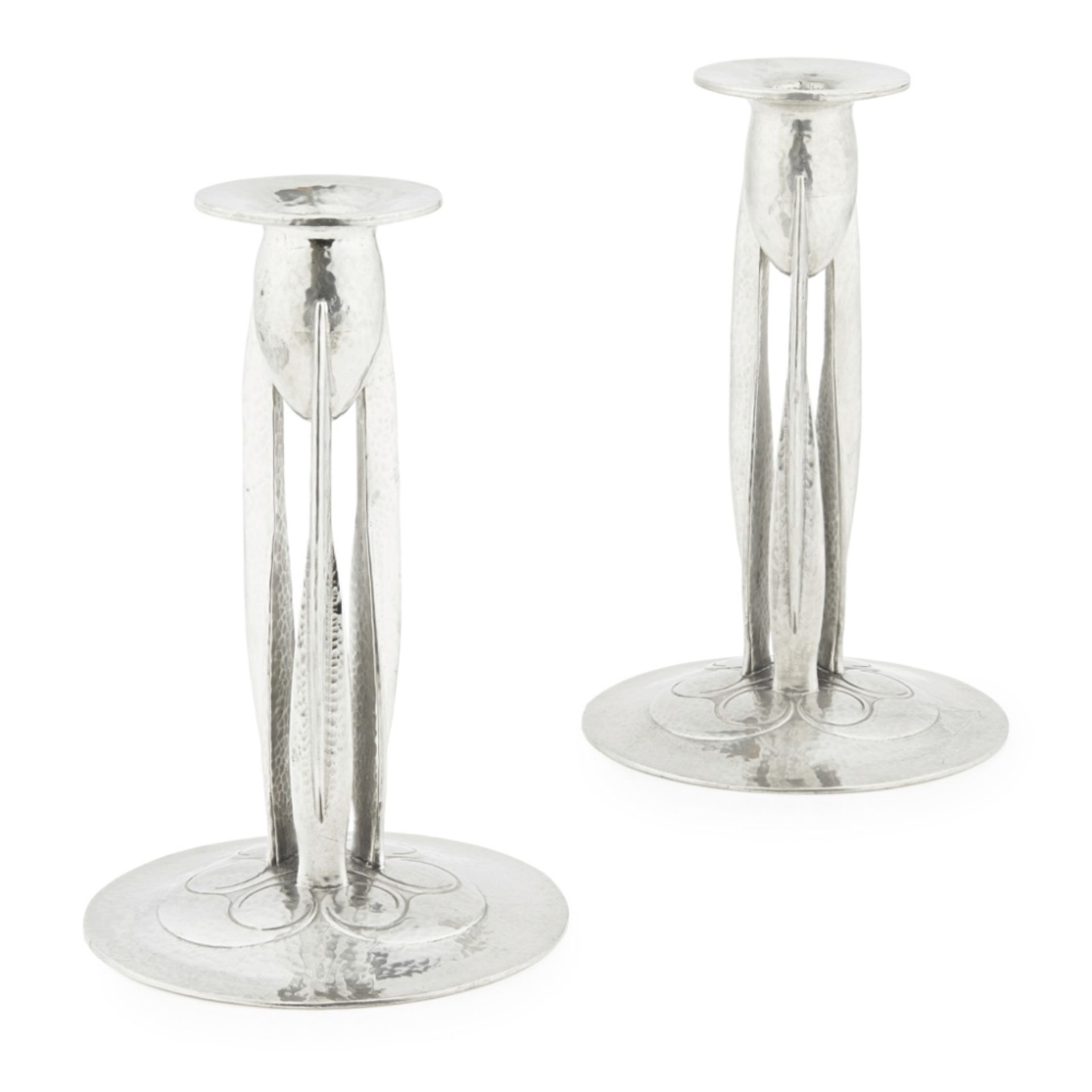 ARCHIBALD KNOX (1864-1933) FOR LIBERTY & CO., LONDON PAIR OF 'TUDRIC' PEWTER CANDLESTICKS, CIRCA