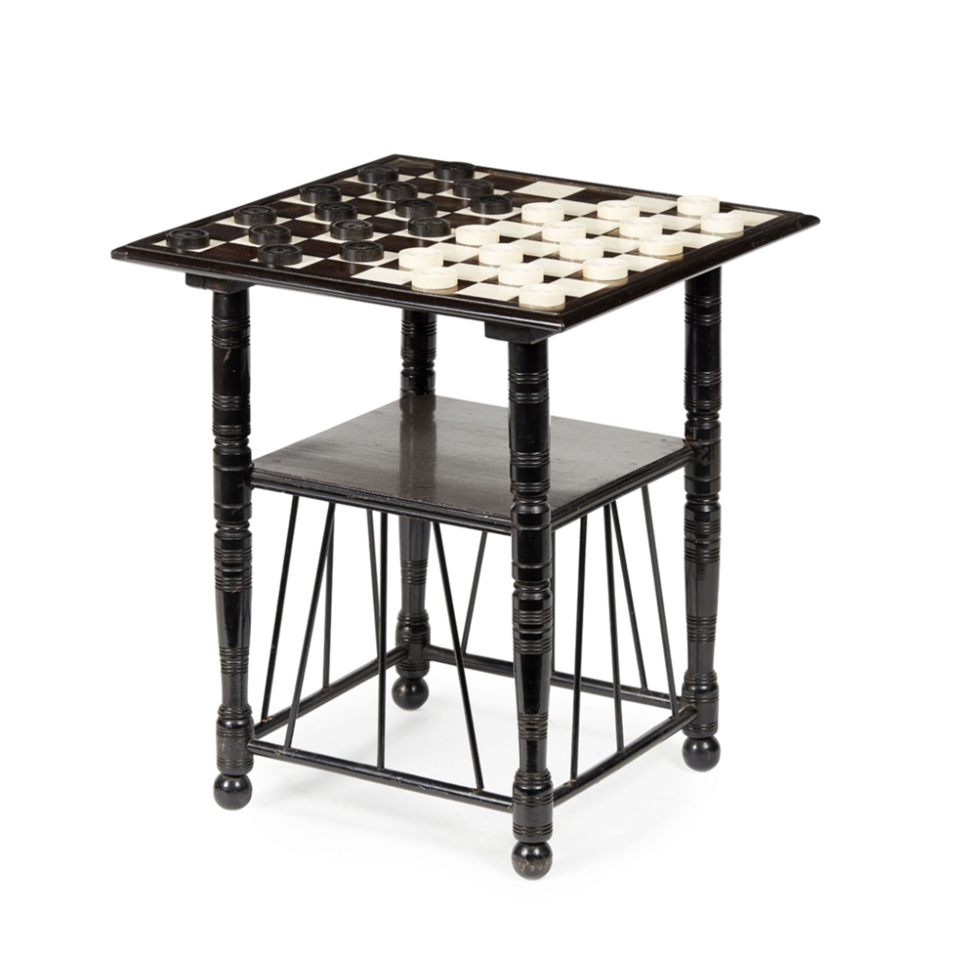 MANNER OF E. W. GODWIN AESTHETIC MOVEMENT EBONISED GAMES TABLE, CIRCA 1880 the square top with an