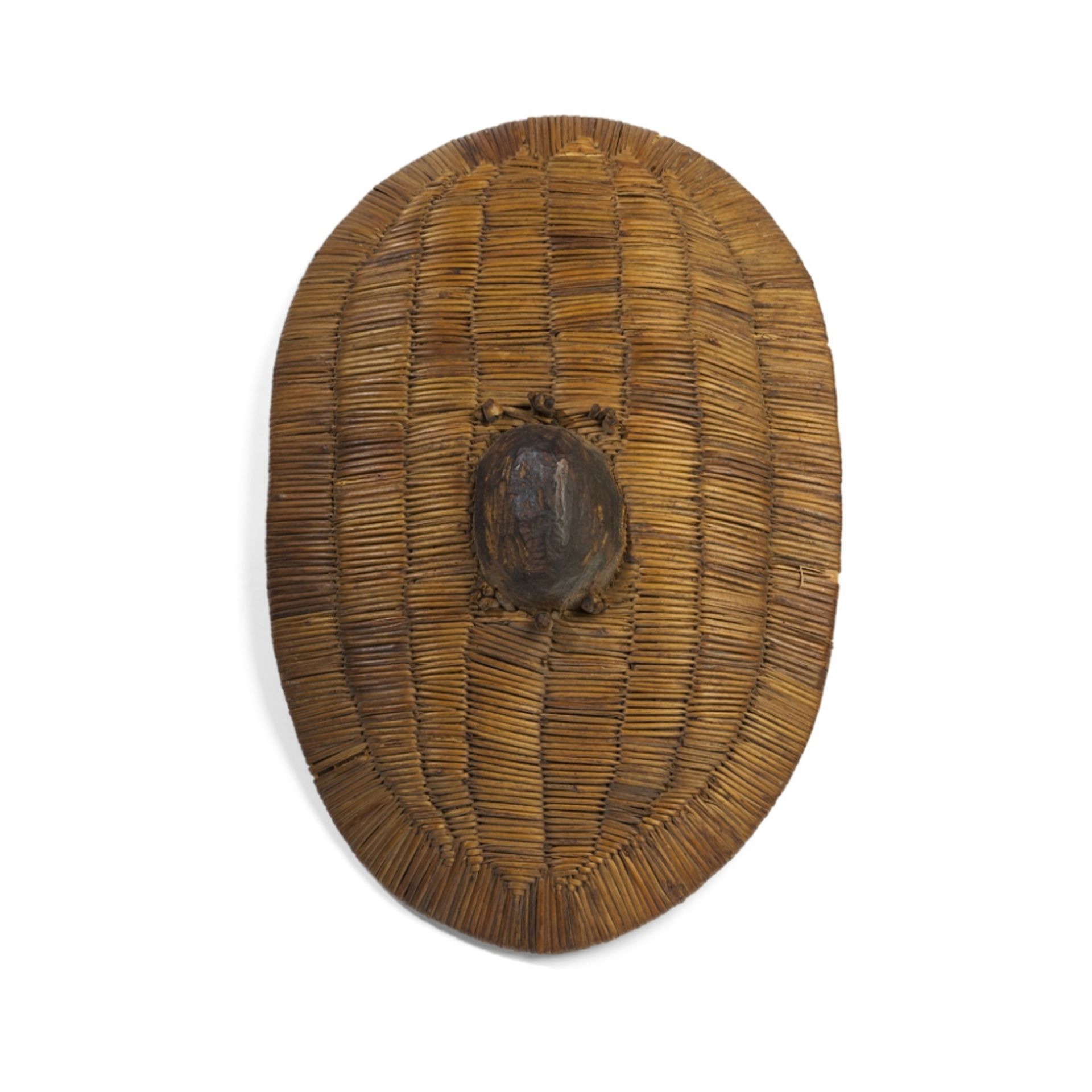 TUTSI SHIELDBURUNDI/RWANDA, EARLY 20TH CENTURY woven cane fibre with wooden boss and pegs, the