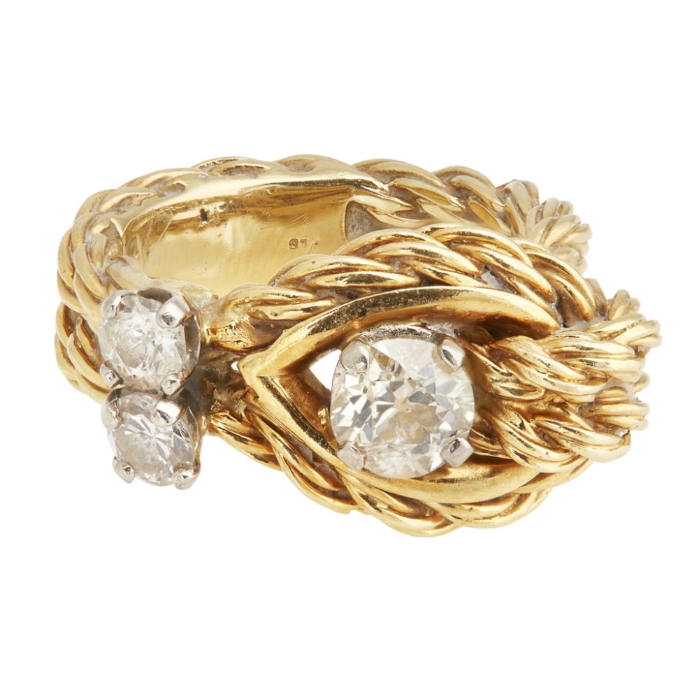 An 18k gold diamond set ring, Kutchinskyof knotted rope-twist design, asymmetrically claw set with
