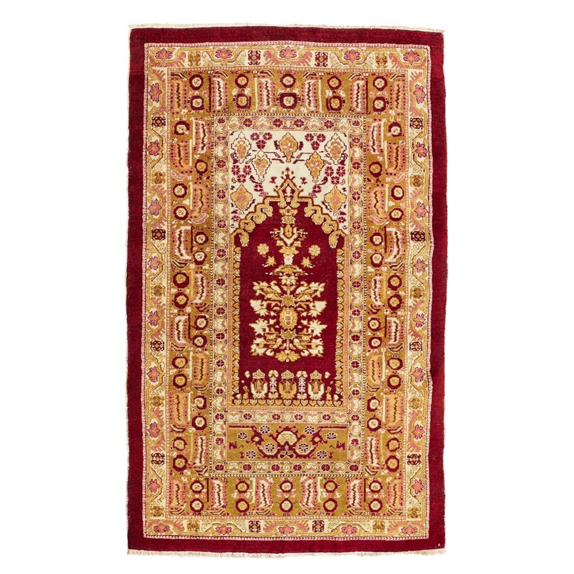 AGRA PRAYER RUG NORTH INDIA, EARLY 20TH CENTURY the red mihrab with cream spandrels, within olive