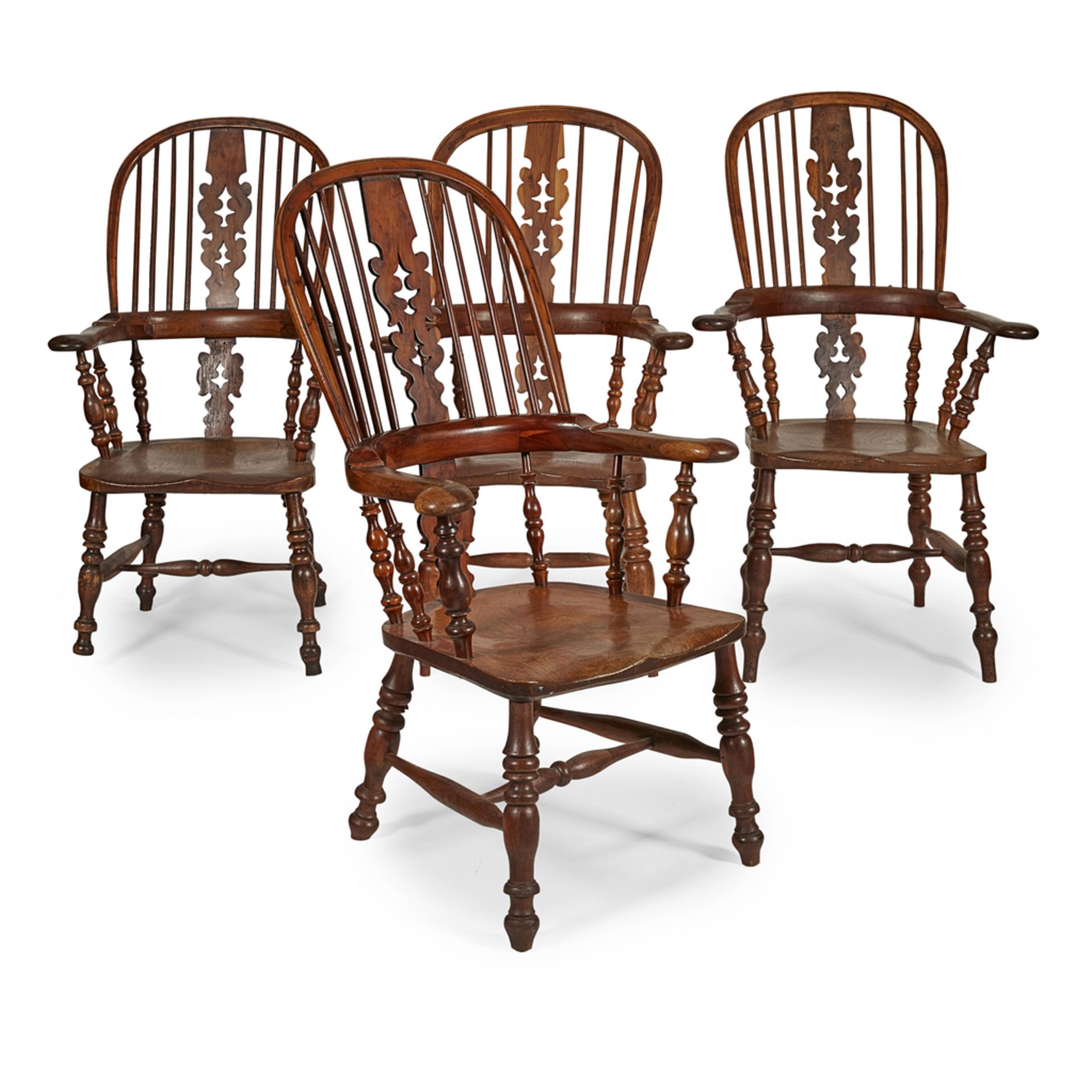 MATCHED SET OF FOUR YEW AND ELM WINDSOR ARMCHAIRS EARLY 19TH CENTURY with hoop backs and pierced