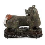 BRONZE MODEL OF A MYTHICAL BEASTdetailed with bulging round eyes and sharp fangs, turning sharply