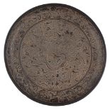 BLACK LACQUER 'NINE DRAGONS' DISHPOSSIBLY YUAN DYNASTY crisply carved in shallow relief with a