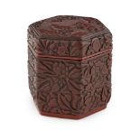 SMALL CARVED CINNABAR LACQUER HEXAGONAL BOXPOSSIBLY MING DYNASTY the top of the cover carved with