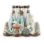 SHIWAN POTTERY FIGURAL GROUP OF THE HEHE TWINSQING DYNASTY, 19TH CENTURY the brothers holding a