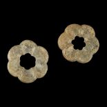PAIR OF JADE RING-FORM ORNAMENTSPOSSIBLY TANG DYNASTY each carved in the form of a floret with six