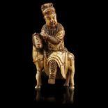 CARVED IVORY EQUESTRIAN FIGURE OF GUANDIMING DYNASTY Guandi shown seated astride a horse with full