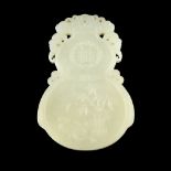 WHITE JADE DOUBLE-GOURD-FORM AMULETcarved in low relief with bamboo on the one side and prunus on