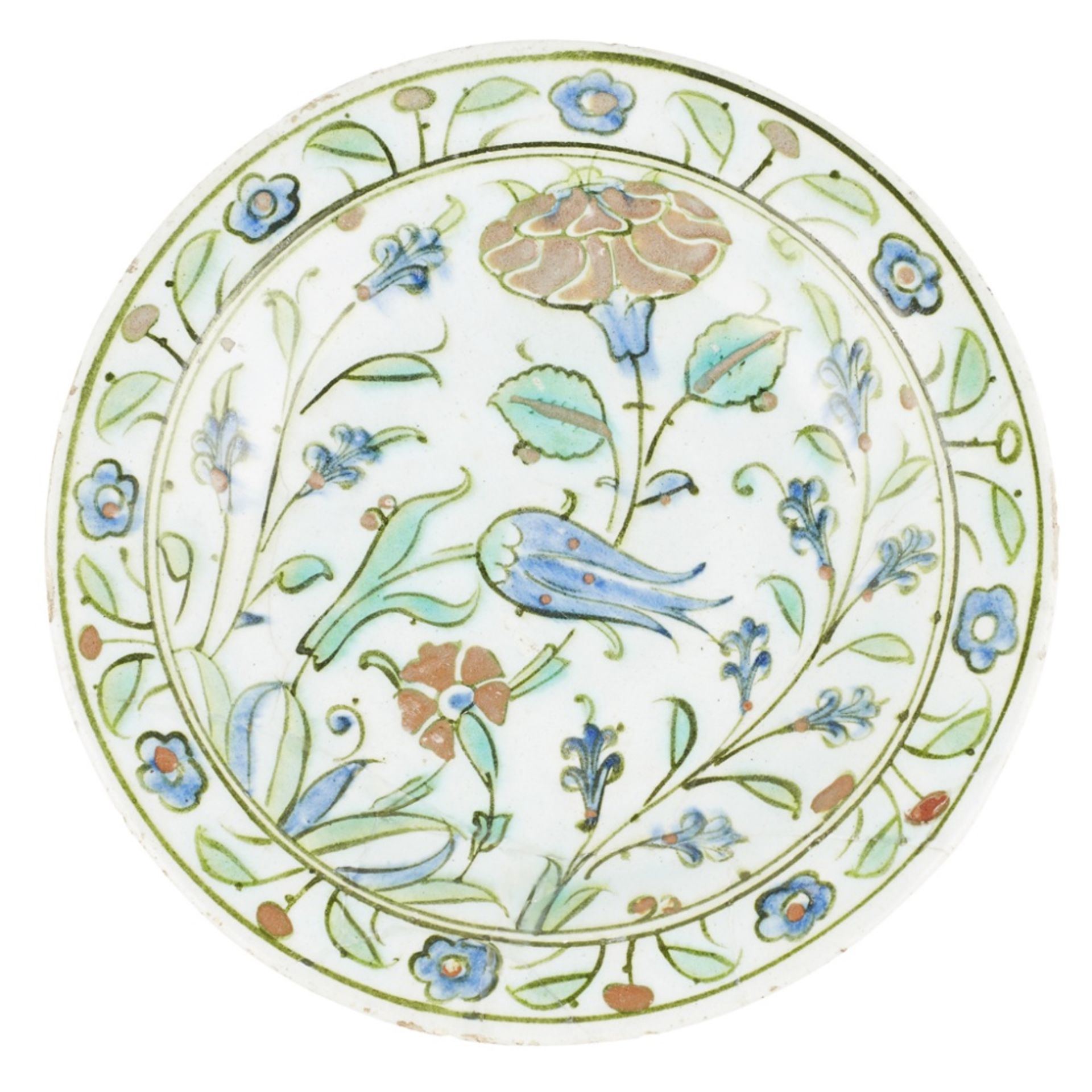 IZNIK UNDERGLAZE-PAINTED POTTERY DISH17TH CENTURY with a flattened rim and shallow well, decorated