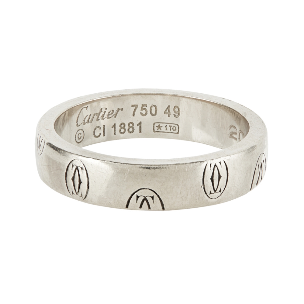 An engraved band, Cartier engraved throughout with double 'C' monogram, signed 'Cartier 750 49 CI