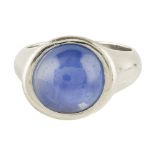 A star sapphire set ring collet set with a star sapphire cabochon, to a plain platinum mount Ring