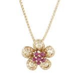 A ruby and diamond set floral pendant claw set with a central cluster of round cut rubies, the