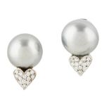 A pair of Tahitian pearl and diamond set stud earrings each set with a large Tahitian cultured