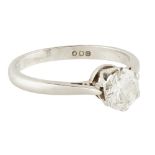 A single stone diamond ring claw set with a single round brilliant cut diamond, to a plain