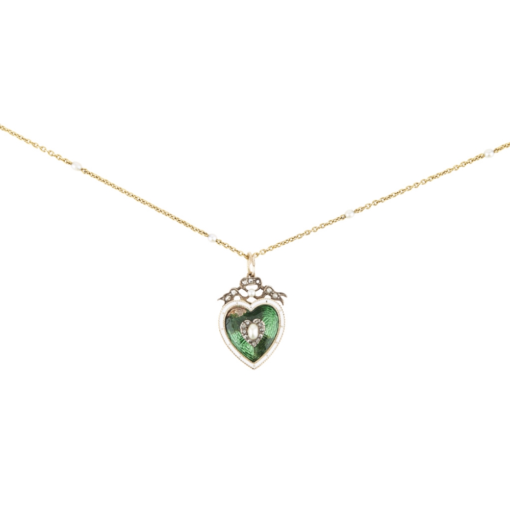 An enamel, pearl and diamond set pendant of heart-shaped outline, the green enamelled ground in a