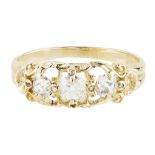 A Victorian three stone diamond set ring claw set with three graduated old cushion cut diamonds,