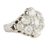 A late 19th century diamond cluster ring set with a cluster of nine graduated old round and