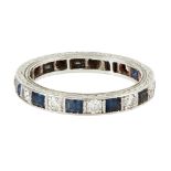 A sapphire and diamond set eternity ring channel set with a continuous row of alternating square cut