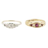 A 18ct gold ruby and diamond set ring set with three graduated round cut rubies and two small old-