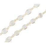 A moonstone necklace composed of a single strand of slightly graduated collet set moonstone