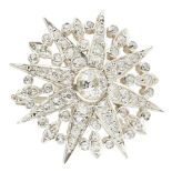 A diamond set star brooch of traditional design, with a circular surround, set throughout with old