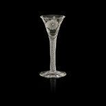 A JACOBITE ENGRAVED WINE GLASS 18TH CENTURY the flared bowl engraved with a rose head flanked by