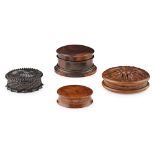 FOUR TURNED AND CARVED WOOD SNUFF BOXES 19TH CENTURY all of circular form, comprising an engine-