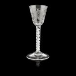 A JACOBITE ENGRAVED WINE GLASS 18TH CENTURY the round funnel bowl engraved with sunflower and a bee,