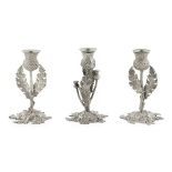 A SET OF THREE PEWTER CANDLESTICKS WILSON & SHARP, EDINBURGH each modelled as a thistle, raised on a